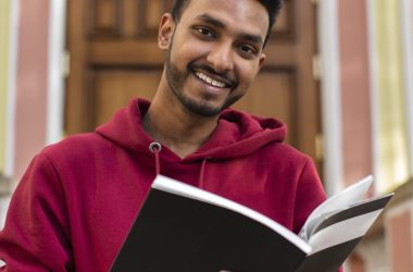 smiley-man-holding-book-front-view